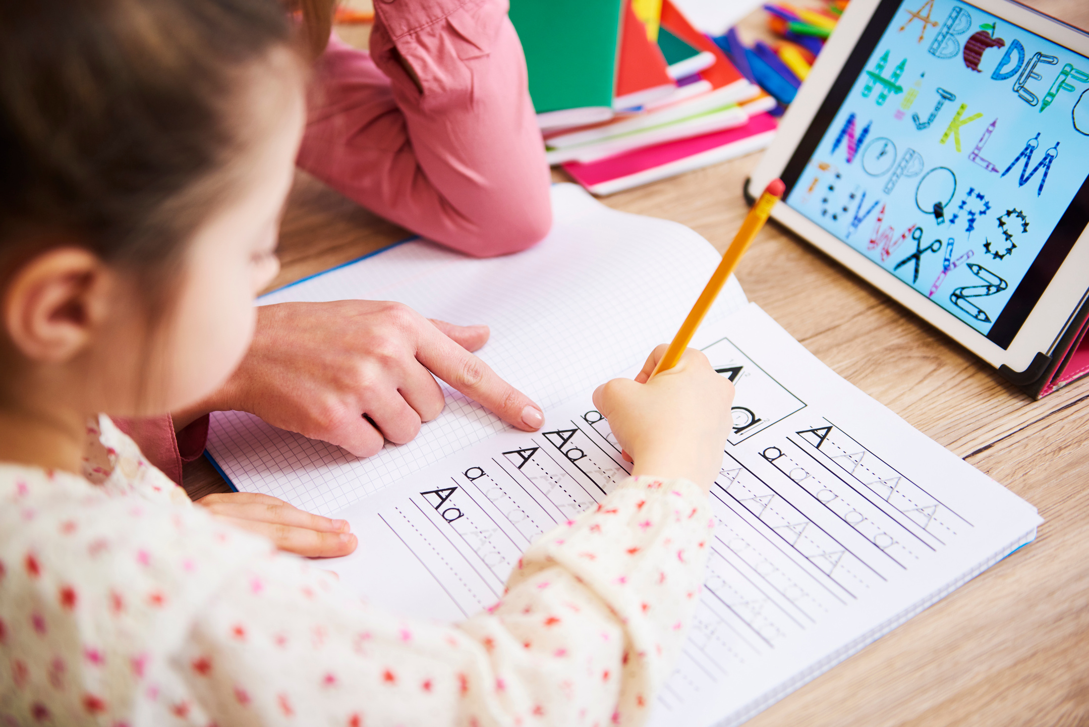 Mother Helping Child with Homework